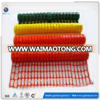 orange construction site plastic safety fence barrier